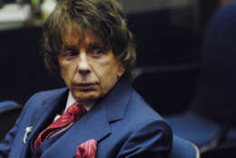 Phil Spector looks on during a hearing at Los Angeles Superior Court in Los Angeles, in this Monday, Oct. 22, 2007, file photo.  A San Francisco lawyer says he will represent Phil Spector in his retrial on a murder charge and that he could not be ready to proceed until September. Doron Weinberg told Superior Court Judge Larry Paul Fidler on Friday, Dec. 7, 2007, that he needs five months to review all the material from Spector's first trial. Spector died Jan. 17, 2020 at age 81. (AP Photo/Chris Pizzello, File)