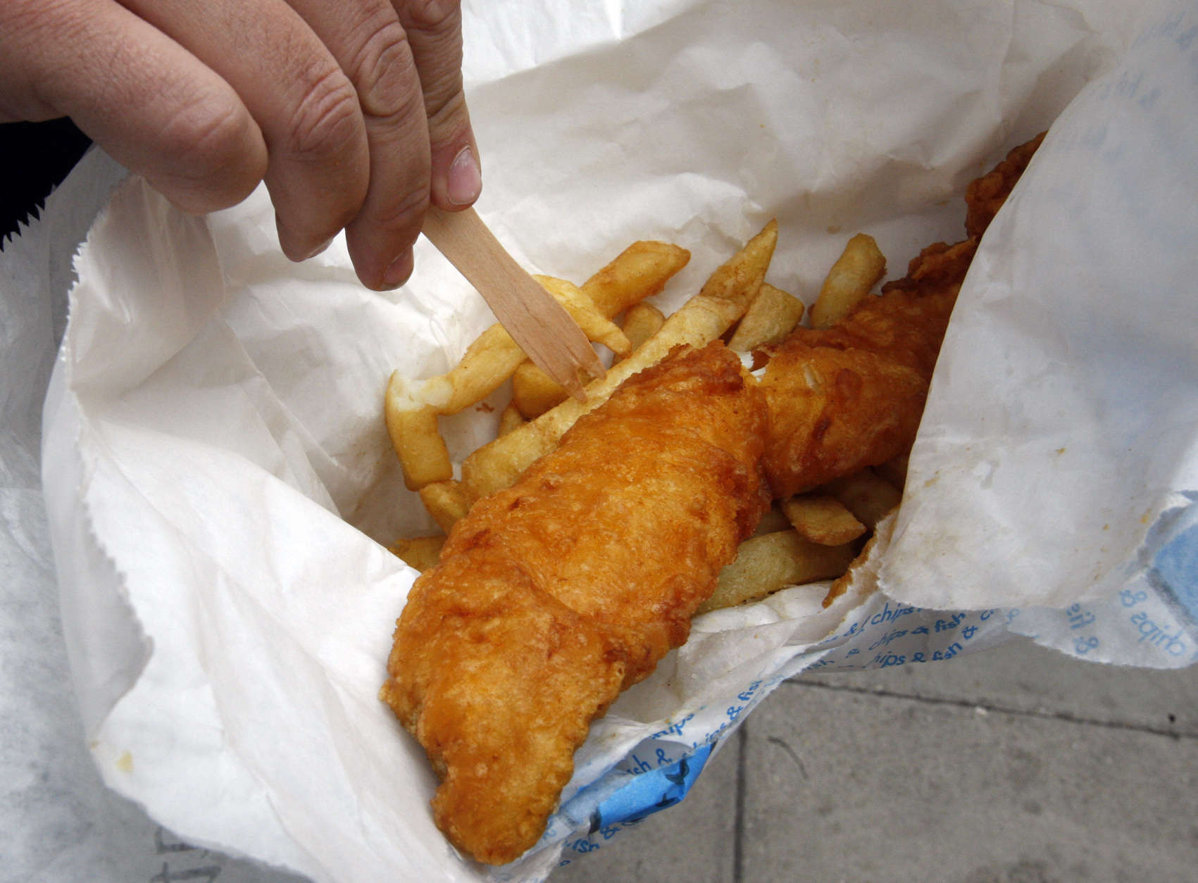 Cod and chips is served up in a traditional Fish and Chip shop in London, Friday, Oct. 16, 2009.  The EU Commission wants cod catch quotas to be cut by twenty-five percent to save threatened fish in key areas, saying the prized fish is sliding toward commercial extinction in several historic Atlantic fishing grounds.(AP Photo/Kirsty Wigglesworth)