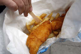 Cod and chips is served up in a traditional Fish and Chip shop in London, Friday, Oct. 16, 2009.  The EU Commission wants cod catch quotas to be cut by twenty-five percent to save threatened fish in key areas, saying the prized fish is sliding toward commercial extinction in several historic Atlantic fishing grounds.(AP Photo/Kirsty Wigglesworth)