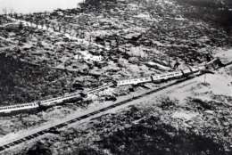 FILE - This September 1935 file photo shows the wreckage of an 11-car passenger train that was derailed by a Labor Day hurricane in the Florida Keys.  The Hurricane Center says no wind measurements were available from the core of this small but vicious hurricane, which was a Category 5 storm when it reached the Florida Keys. But a pressure measurement taken at Long Key, Fla., makes it the most intense hurricane ever to make landfall on the U.S. mainland. It was blamed for 408 deaths and caused an estimated $6 million (1935 dollars) in damage. (AP Photo, File)