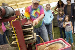 With the apple harvest at its peak in Virginia's Shenandoah Valley, red delicious and jonagolds are pressed for cider by Lynn West at Hartland Orchard near Markham , Va., Saturday, Sept. 17, 2011. (AP Photo/J. Scott Applewhite)