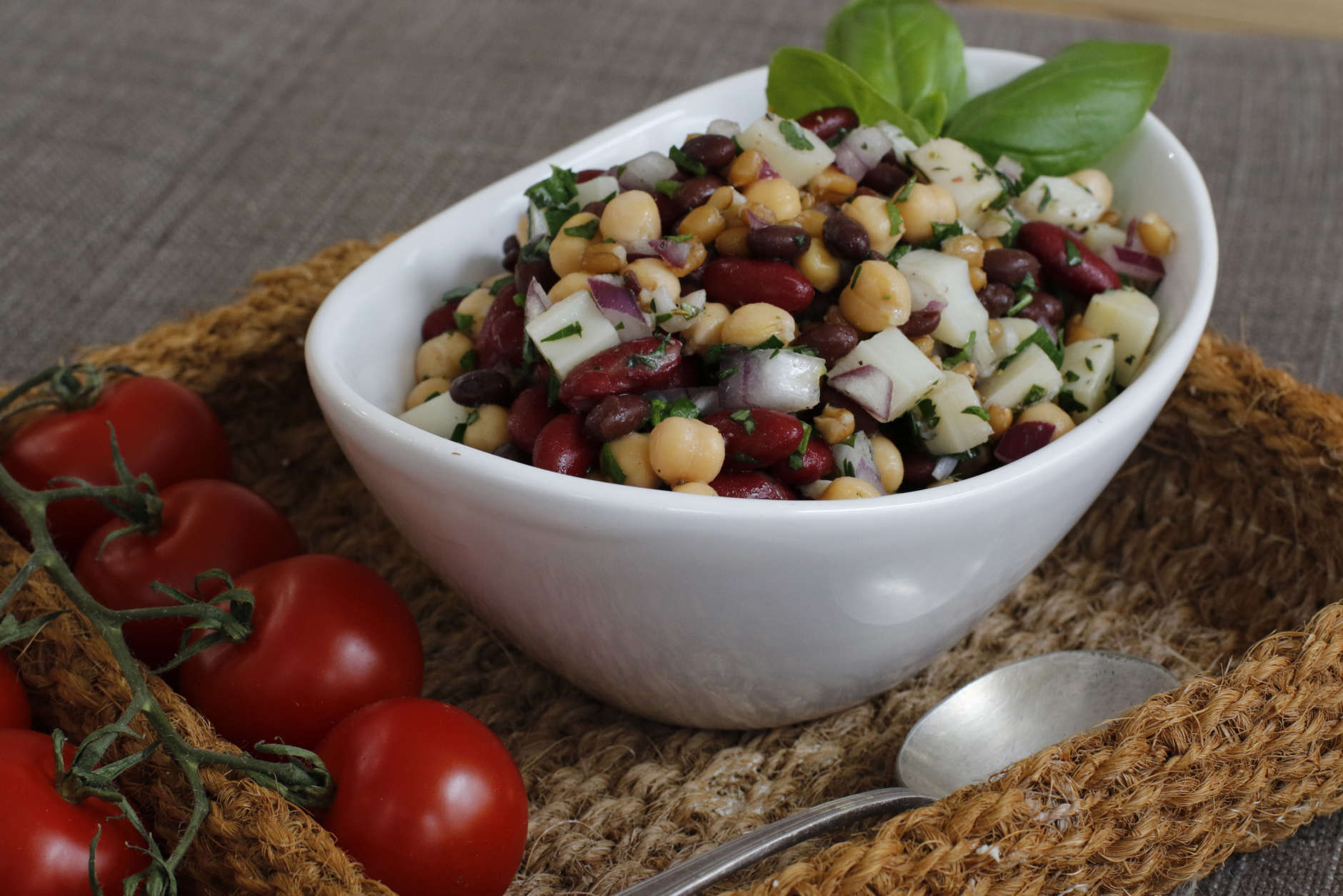 This March 14, 2016 photos shows bright and herby three-bean salad in Concord, N.H. This classic salad is given tons of new interest with the addition of spelt, canned hearts of palm and a generous helping of fresh herbs. (AP Photo/J.M. Hirsch)