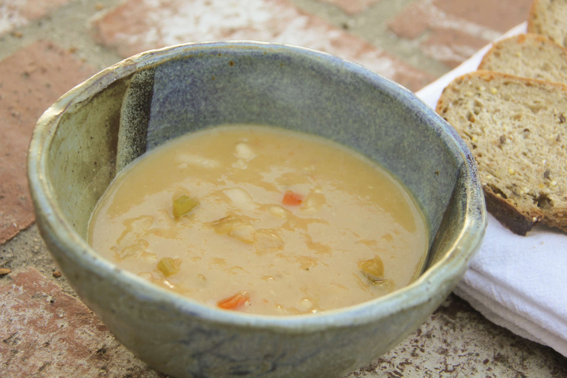 This March 26, 2017 photo shows white bean and garlic soup in Coronado, Calif. This dish is from a recipe by Melissa d'Arabian. (Melissa d'Arabian via AP)