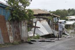 A man surveys the wreckage on his property after the passing of Hurricane Irma, in St. John's, Antigua and Barbuda, Wednesday, Sept. 6, 2017. Heavy rain and 185-mph winds lashed the Virgin Islands and Puerto Rico's northeast coast as Irma, the strongest Atlantic Ocean hurricane ever measured, roared through Caribbean islands on its way to a possible hit on South Florida. (AP Photo/Johnny Jno-Baptiste)