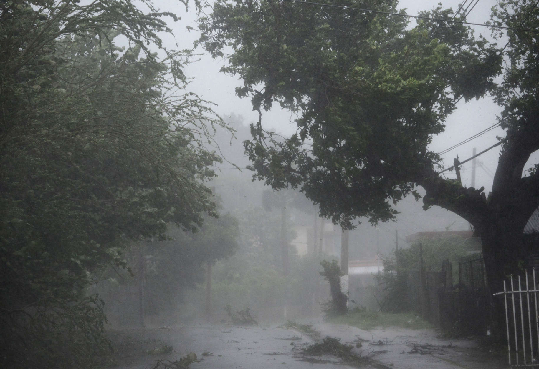 High winds and rain sweep through the streets of the Matelnillo community during the passage of hurricane Irma, in Fajardo, Puerto Rico, Wednesday, Sept. 6, 2017. The US territory was first to declare a state of emergency las Monday, as the National Hurricane Center forecast that the storm would strike the Island Wednesday. (AP Photo/Carlos Giusti)