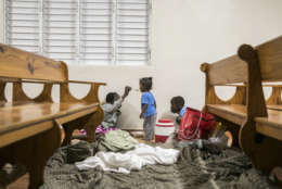 Kids have dinner at a shelter in a local church during the evening before the arrival of Hurricane Irma in Las Terrenas, Dominican Republic, Wednesday, Sept. 6, 2017. Dominicans wait for the arrival of Hurricane Irma after it lashed Puerto Rico with heavy rain and powerful winds, leaving nearly 900,000 people without power as authorities struggled to get aid to small Caribbean islands already devastated by the historic storm. (AP Photo/Tatiana Fernandez)
