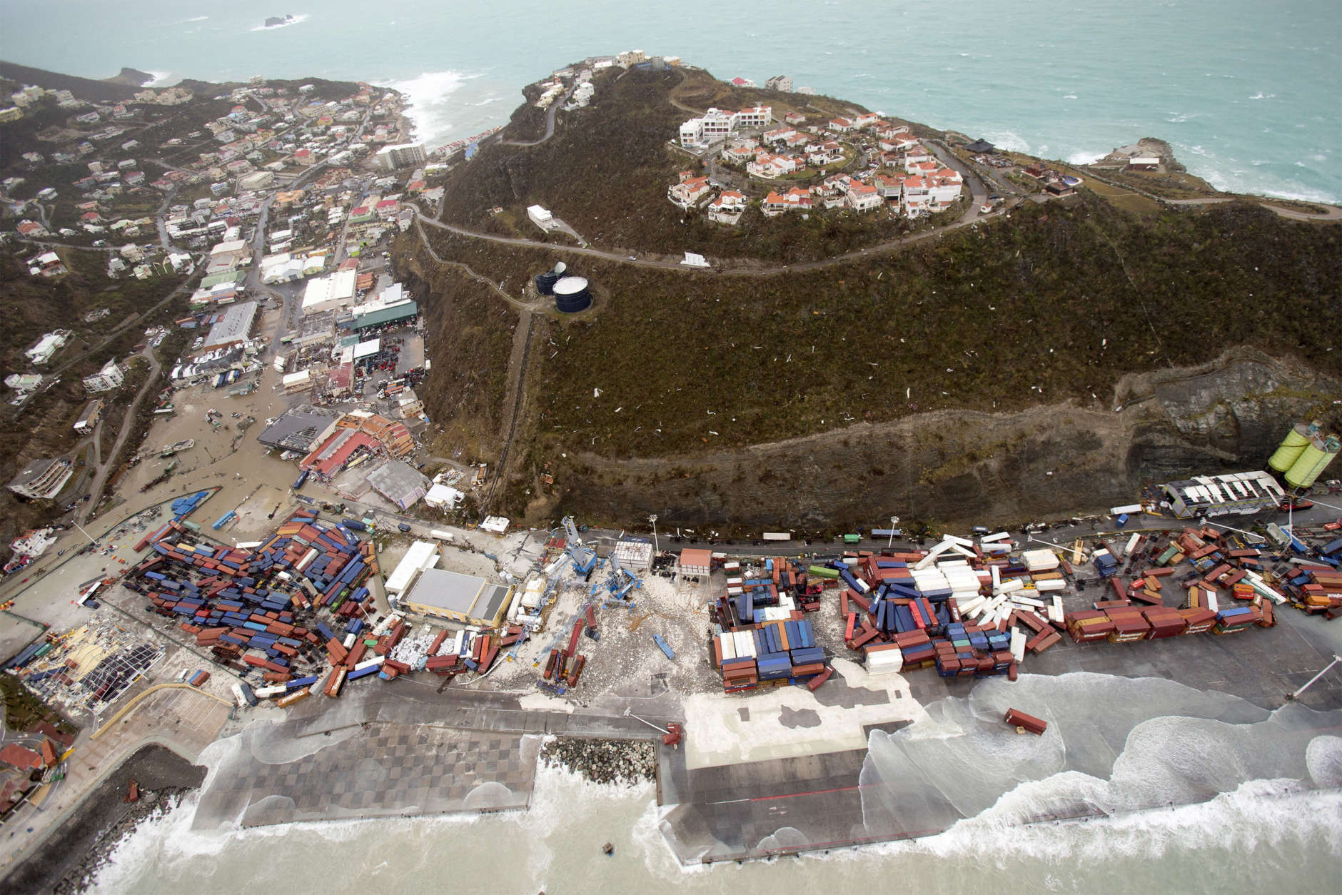 This Sept. 6, 2017 photo provided by the Dutch Defense Ministry shows a view of St. Maarten, in the aftermath of Hurricane Irma. Irma cut a path of devastation across the northern Caribbean, leaving thousands homeless after destroying buildings and uprooting trees. Significant damage was reported on the island that is split between French and Dutch control. (Gerben Van Es/Dutch Defense Ministry via AP)
