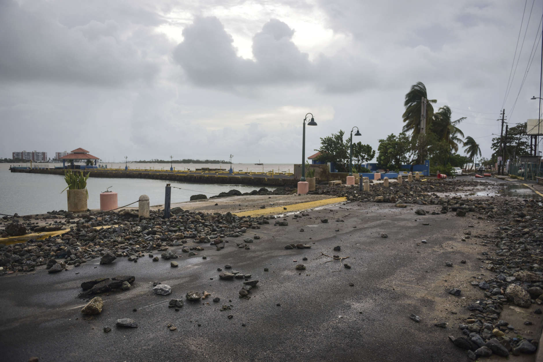 Rocks are scattered on a road in the aftermath of Hurricane Irma, in Fajardo, Puerto Rico, Thursday, Sept. 7, 2017. Irma cut a path of devastation across the northern Caribbean, leaving at least 10 dead and thousands homeless after destroying buildings and uprooting trees. More than 1 million people in Puerto Rico are without power. (AP Photo/Carlos Giusti)