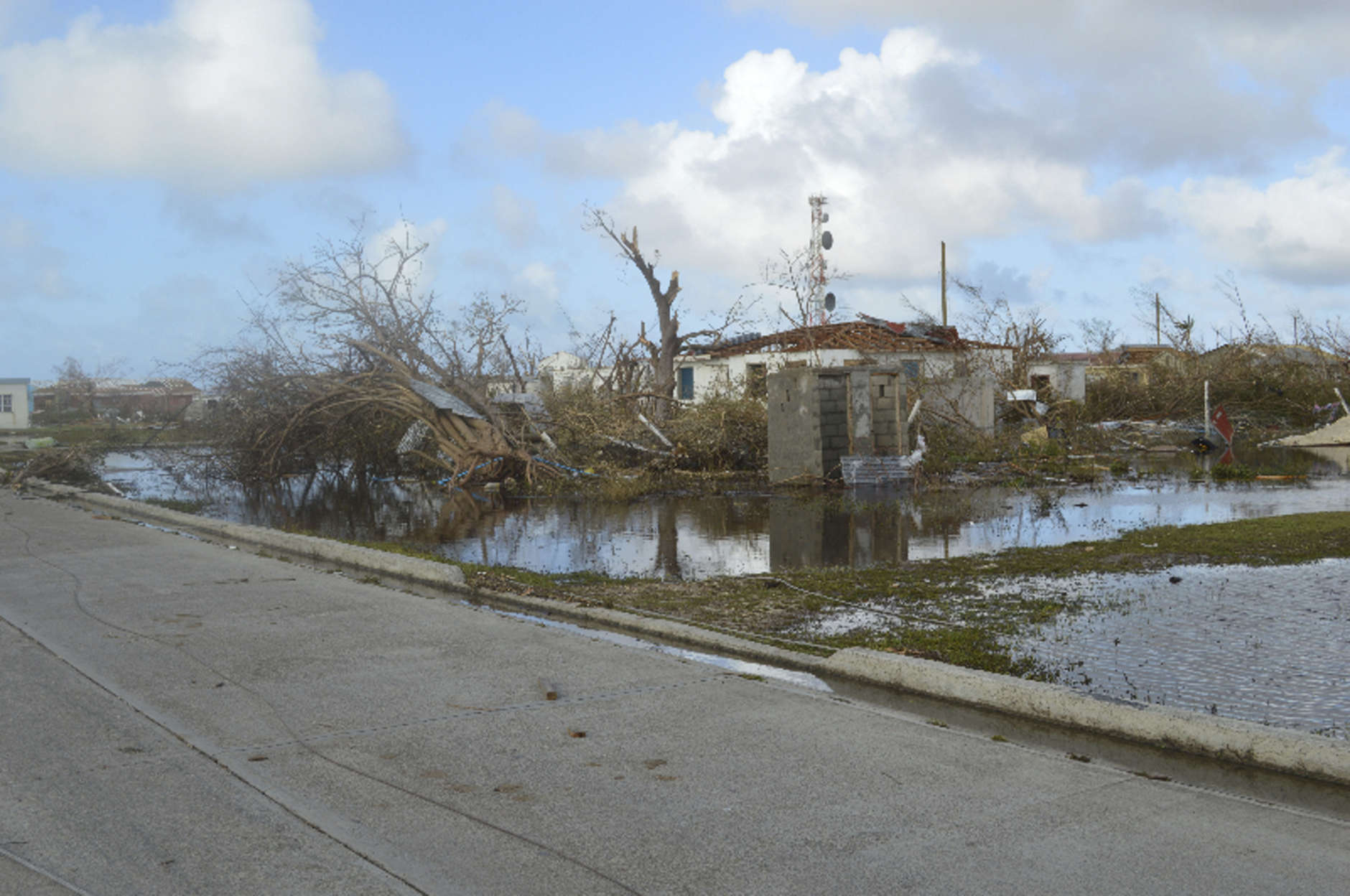 In this Thursday, Sept. 7, 2017, photo, damage is left after Hurricane Irma hit Barbuda. Hurricane Irma battered the Turks and Caicos Islands early Friday as the fearsome Category 5 storm continued a rampage through the Caribbean that has killed a number of people, with Florida in its sights. (AP Photo/Anika E. Kentish)