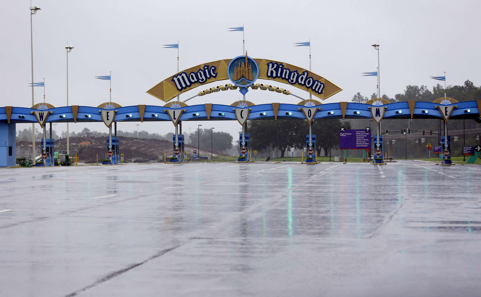 The entrance to the Magic Kingdom at Disney World is empty as the theme park was closed because of Hurricane Irma, Sunday, Sept. 10, 2017, in Lake Buena Vista, Fla. Other tourists attractions including Universal Studios and Sea World were also closed and planned to reopen Tuesday. (AP Photo/John Raoux)
