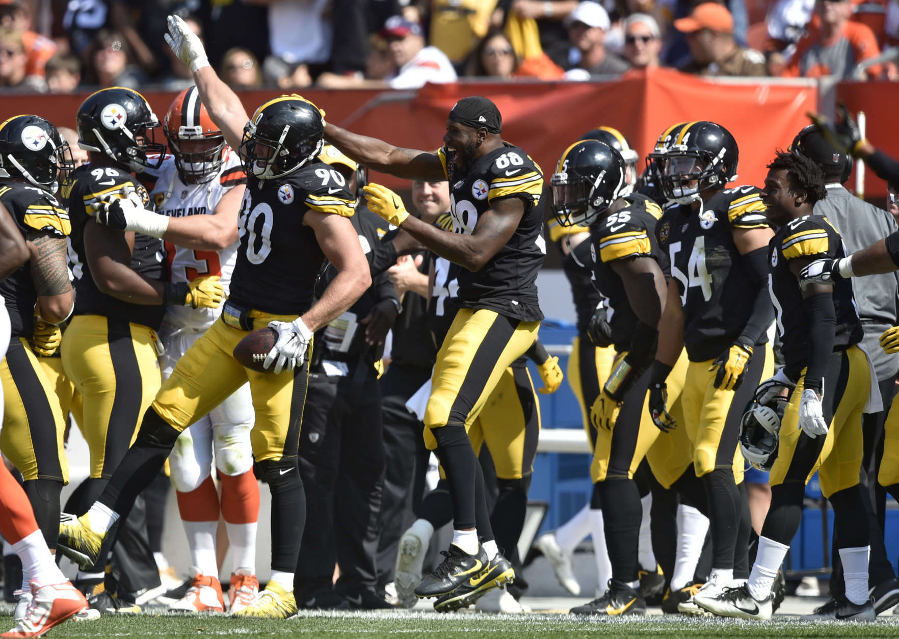 Pittsburgh Steelers linebacker T.J. Watt (90) celebrates with teammates after making an interception during the second half of an NFL football game against the Cleveland Browns, Sunday, Sept. 10, 2017, in Cleveland. (AP Photo/David Richard)