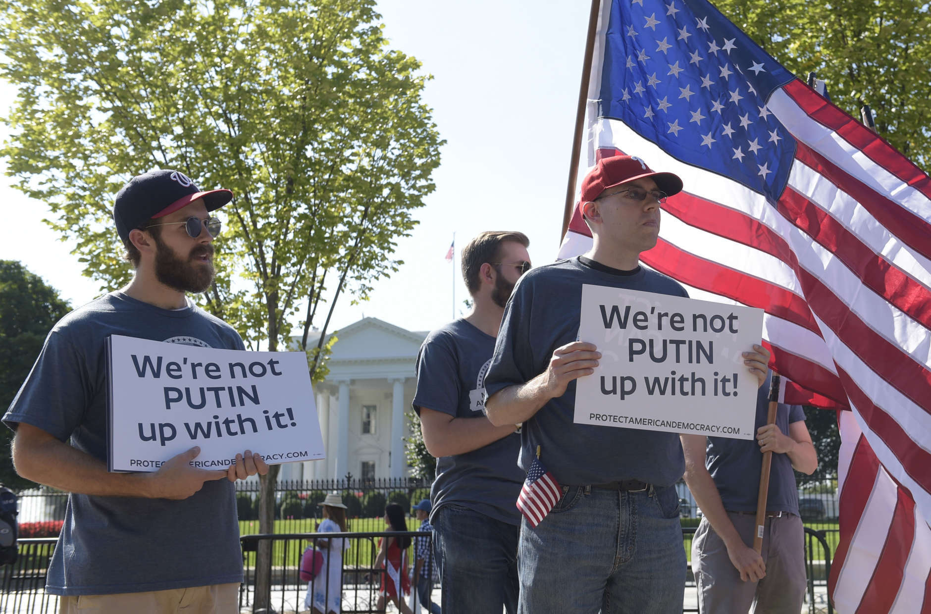 Protesters gather at the White House in Washington, Saturday, Sept. 16, 2017, during a rally encouraging President Donald Trump and House Speaker Paul Ryan to defend American democracy from Russian interference. (AP Photo/Susan Walsh)
