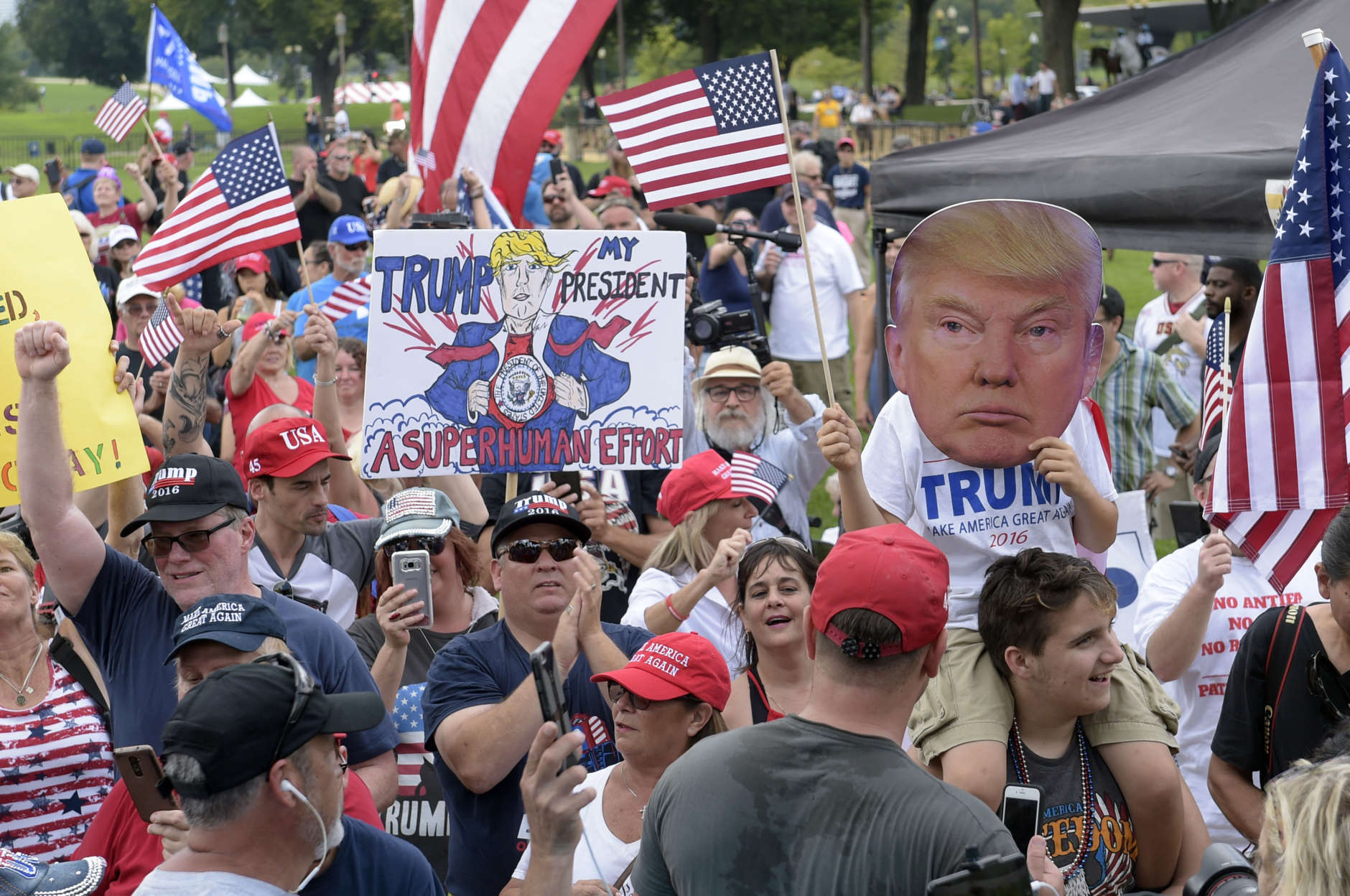 People gather on the National Mall in Washington, Saturday, Sept. 16, 2017, to attend a rally in support of President Donald Trump in what organizers are calling 'The Mother of All Rallies." (AP Photo/Susan Walsh)