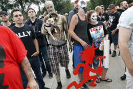 Juggalos, as supporters of the rap group Insane Clown Posse are known, gather in front of the Lincoln Memorial in Washington during a rally, Saturday, Sept. 16, 2017, to protest and demand that the FBI rescind its classification of the juggalos as "loosely organized hybrid gang." (AP Photo/Pablo Martinez Monsivais)