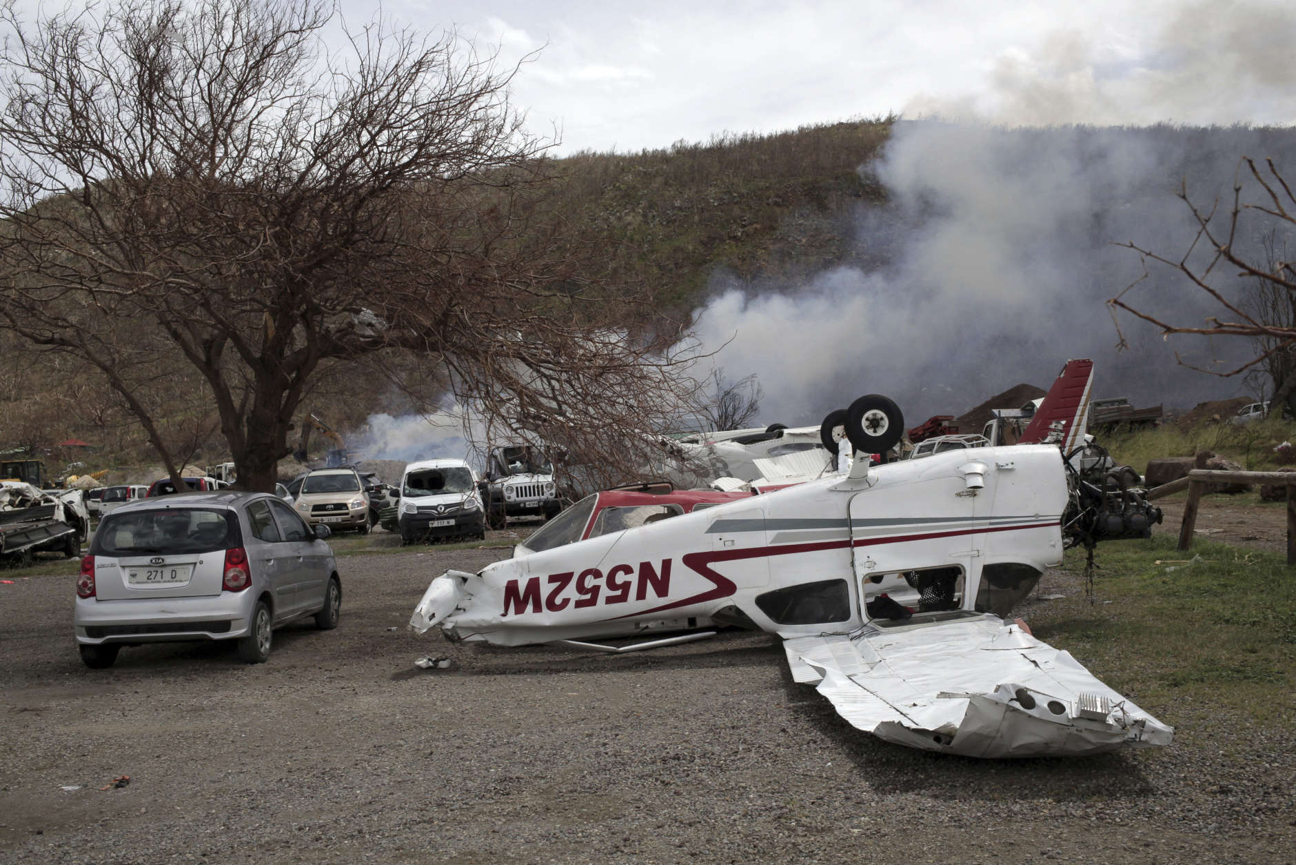A small plane lays flipped over, one week after the passing of Hurricane Irma, at the airport parking lot on the outskirts of Gustavia, St. Barthelemy, part of the French Antilles, Monday, Sept. 18, 2017. Hurricane Maria is passing far south of St. Barthelemy on Tuesday and charging into the eastern Caribbean that threatens islands already devastated by Hurricane Irma. (Enrico Dagnino via AP)