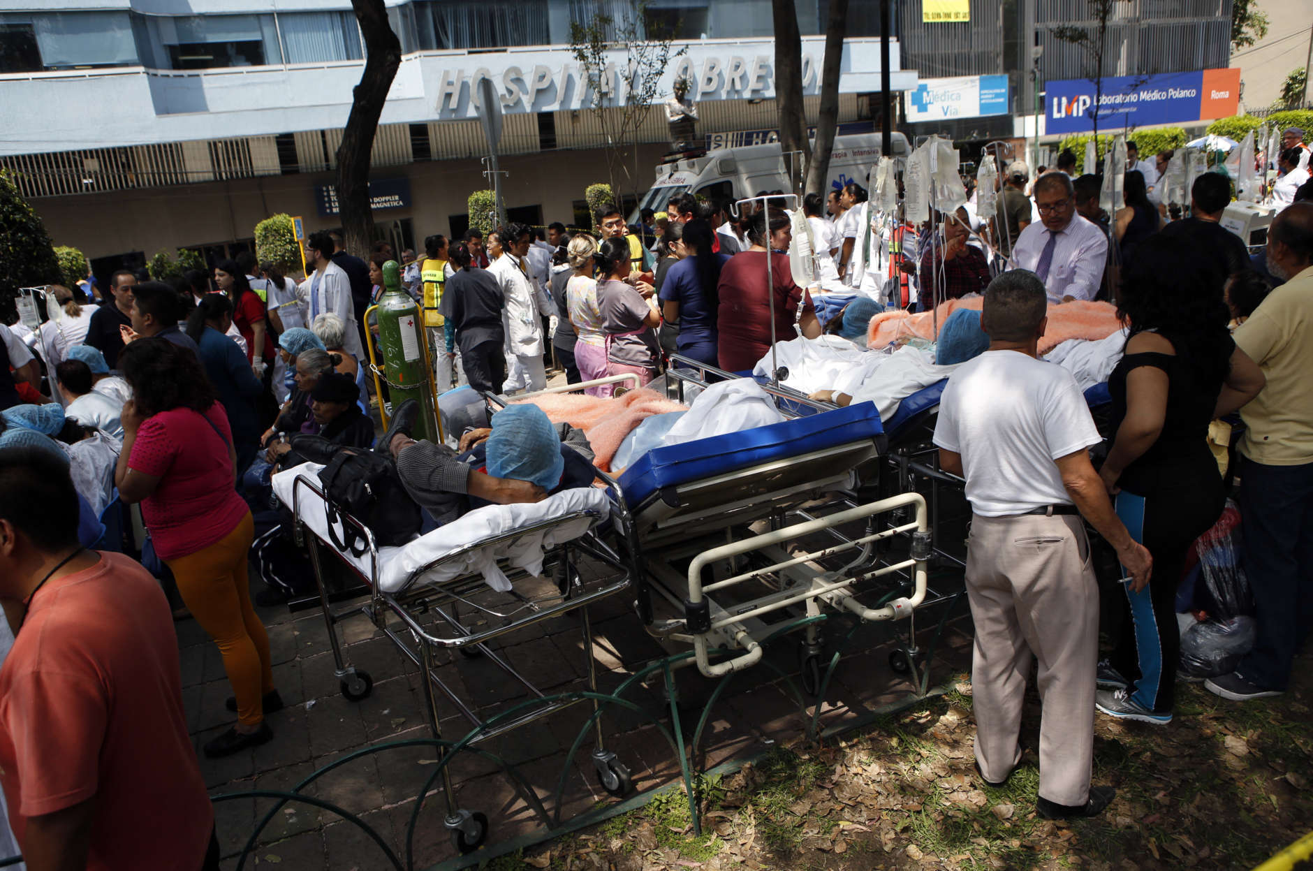 CORRECTS BYLINE - Patients lie on their hospital beds after being evacuated following an earthquake in Mexico City, Tuesday, Sept. 19, 2017. A powerful earthquake jolted central Mexico on Tuesday, causing buildings to sway sickeningly in the capital on the anniversary of a 1985 quake that did major damage. (AP Photo/Rebecca Blackwell)