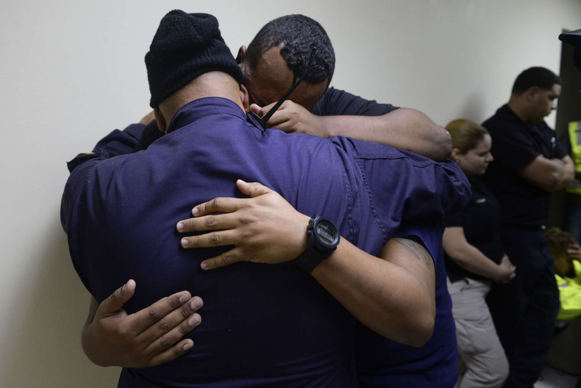 Feelings of frustration surround the members of the rescue team from the municipality of Humacao, desperate to go out to attend several calls for help from citizens in need of assistance during the impact of Maria, a Category 5 hurricane that started to hit the eastern region of the island, in Humacao, Puerto Rico, Tuesday, Sept. 20, 2017. At that point, Maria downgraded to a category 4 hurricane. (AP Photo/Carlos Giusti)