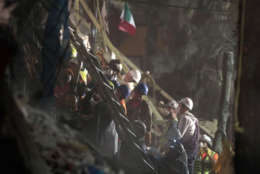 Personnel work in rescue operations in the rubble of a building felled by a 7.1 magnitude earthquake, in the Ciudad Jardin neighborhood of Mexico City, Thursday, Sept. 21, 2017. Thousands of professionals and volunteers are working frantically at dozens of wrecked buildings across the capital and nearby states looking for survivors of the powerful quake that hit Tuesday. (AP Photo/Eduardo Verdugo)