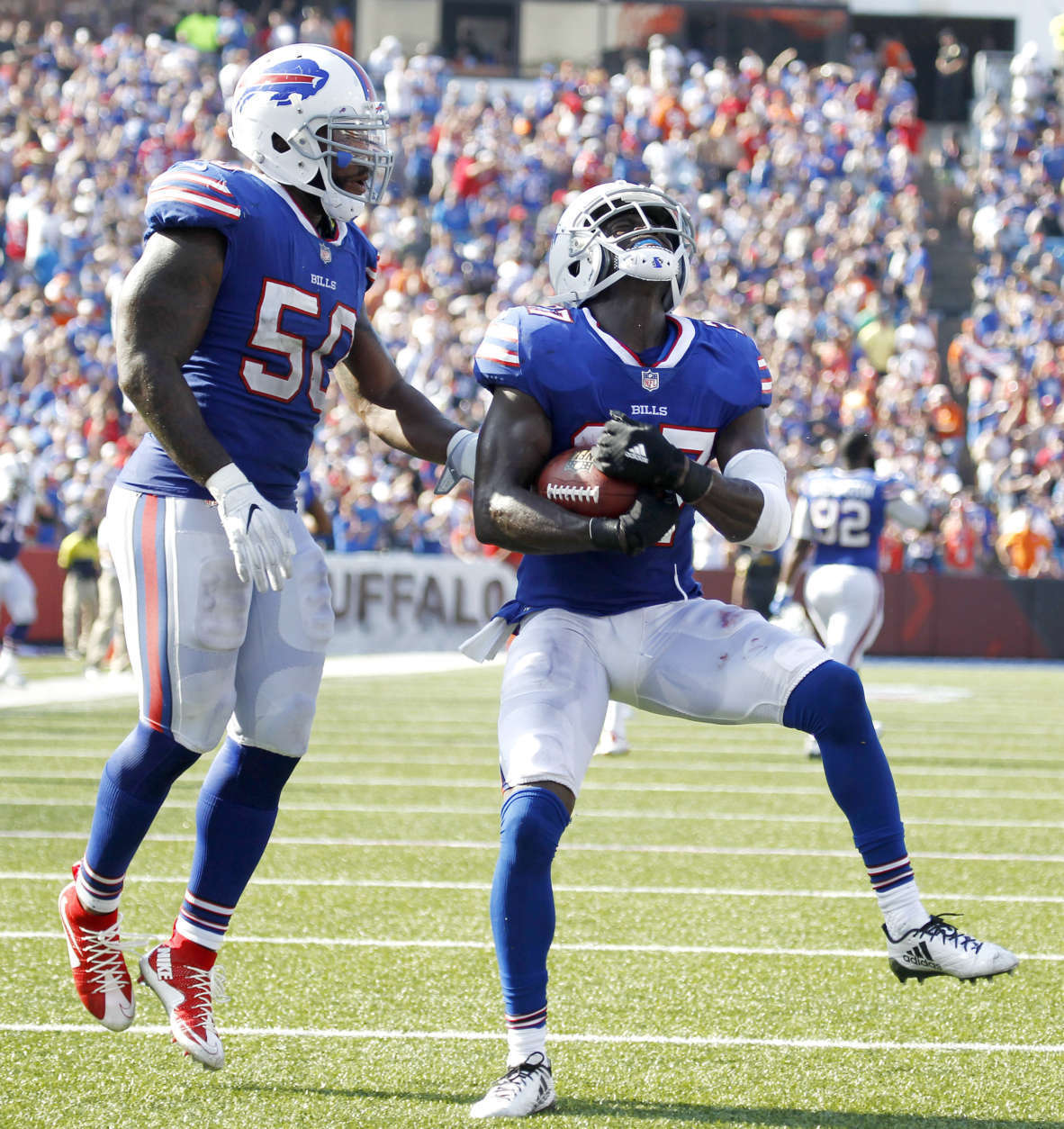 Buffalo Bills cornerback Tre'Davious White, right, and outside linebacker Ramon Humber celebrate White's interception on a pass from Denver Broncos quarterback Trevor Siemian, not pictured, during the second half of an NFL football game, Sunday, Sept. 24, 2017, in Orchard Park, N.Y. (AP Photo/Jeffrey T. Barnes)