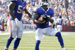 Buffalo Bills cornerback Tre'Davious White, right, and outside linebacker Ramon Humber celebrate White's interception on a pass from Denver Broncos quarterback Trevor Siemian, not pictured, during the second half of an NFL football game, Sunday, Sept. 24, 2017, in Orchard Park, N.Y. (AP Photo/Jeffrey T. Barnes)