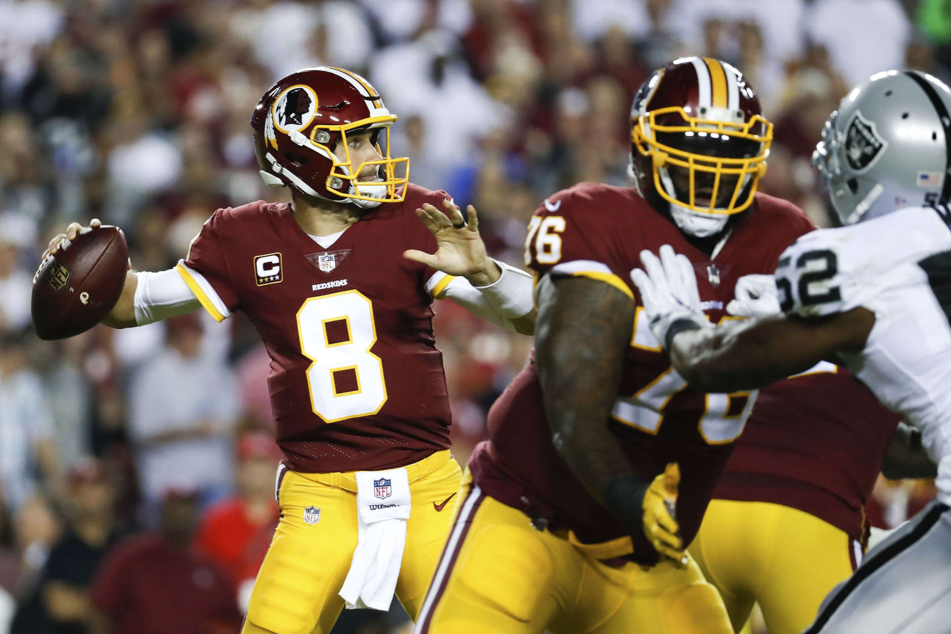 Washington Redskins quarterback Kirk Cousins (8) passes the ball during the first half of an NFL football game against the Oakland Raiders in Landover, Md., Sunday, Sept. 24, 2017. (AP Photo/Alex Brandon)