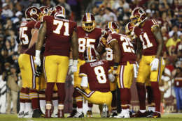 Washington Redskins quarterback Kirk Cousins (8) leads the huddle during the first half of an NFL football game against the Oakland Raiders in Landover, Md., Sunday, Sept. 24, 2017. (AP Photo/Pablo Martinez Monsivais)