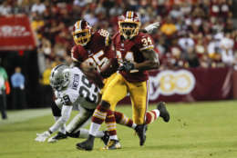 Washington Redskins running back Mack Brown (34) carries the ball during the second half of an NFL football game against the Oakland Raiders in Landover, Md., Sunday, Sept. 24, 2017. The Redskins defeated the Raiders 27-10. (AP Photo/Pablo Martinez Monsivais)