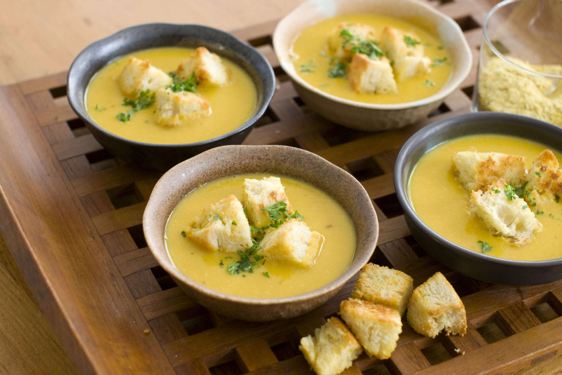 In this image taken on Feb. 13, 2012, nutritional yeast flakes lend a savory, cheesy flavor to this winter-friendly pumpkin and white bean soup with sourdough croutons as shown in Concord, N.H. (AP Photo/Matthew Mead)