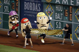 Cheese Chester breaks the tape to win the Pierogi Race between innings of a baseball game at PNC Park in Pittsburgh, between the Pittsburgh Pirates and the Miami Marlins, Tuesday, May 26, 2015. The Pirates won 5-1. (AP Photo/Gene J. Puskar)