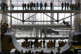 Spectators watch a cyclist perform on a half pipe at COBO Center in conjunction with the Shell Eco-marathon Americas competition in Detroit Friday, April 10, 2015. (AP Photo/Paul Sancya)