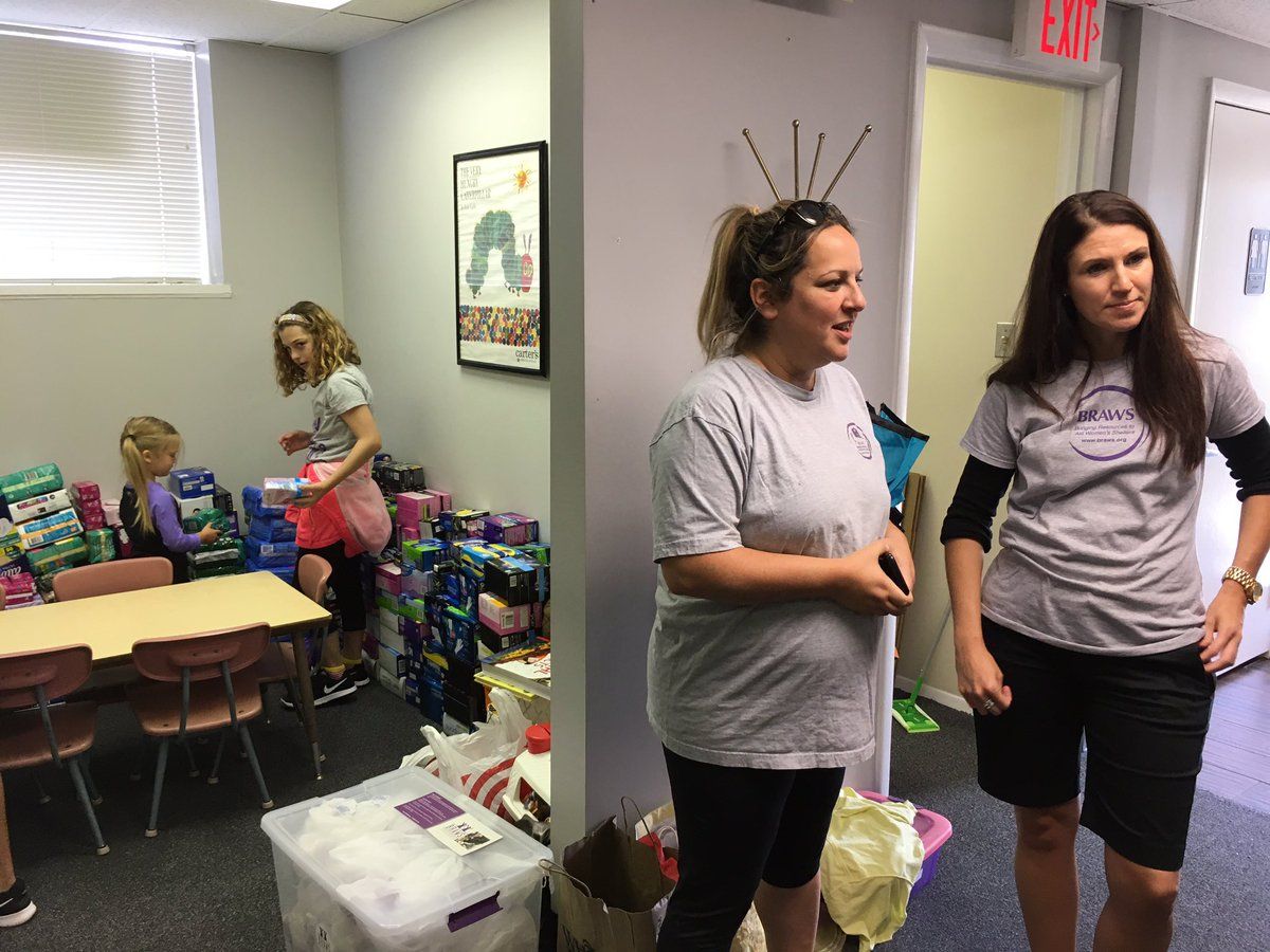 “We collect pads, tampons, sealed packages of underwear, and bras with tags on only. We don’t accept anything used,” said Holly Seibold, founder and executive director of BRAWS. (WTOP/Liz Anderson) 