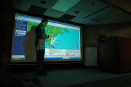 A mission briefing at Kessler Air Force Base in Biloxi, Mississippi preceded the flight into Hurricane Irene. The briefing, lead by the squadron's chief Aerial Reconnaissance Weather Officer, Lt. Col. Jon Talbot, featured guidance from the National Hurricane Center based in Miami, Florida. (WTOP/Dave Dildine)