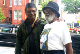Ron Gregory poses with a fan of the late comedian and activist before the parade in his honor. (WTOP/Kathy Stewart) 