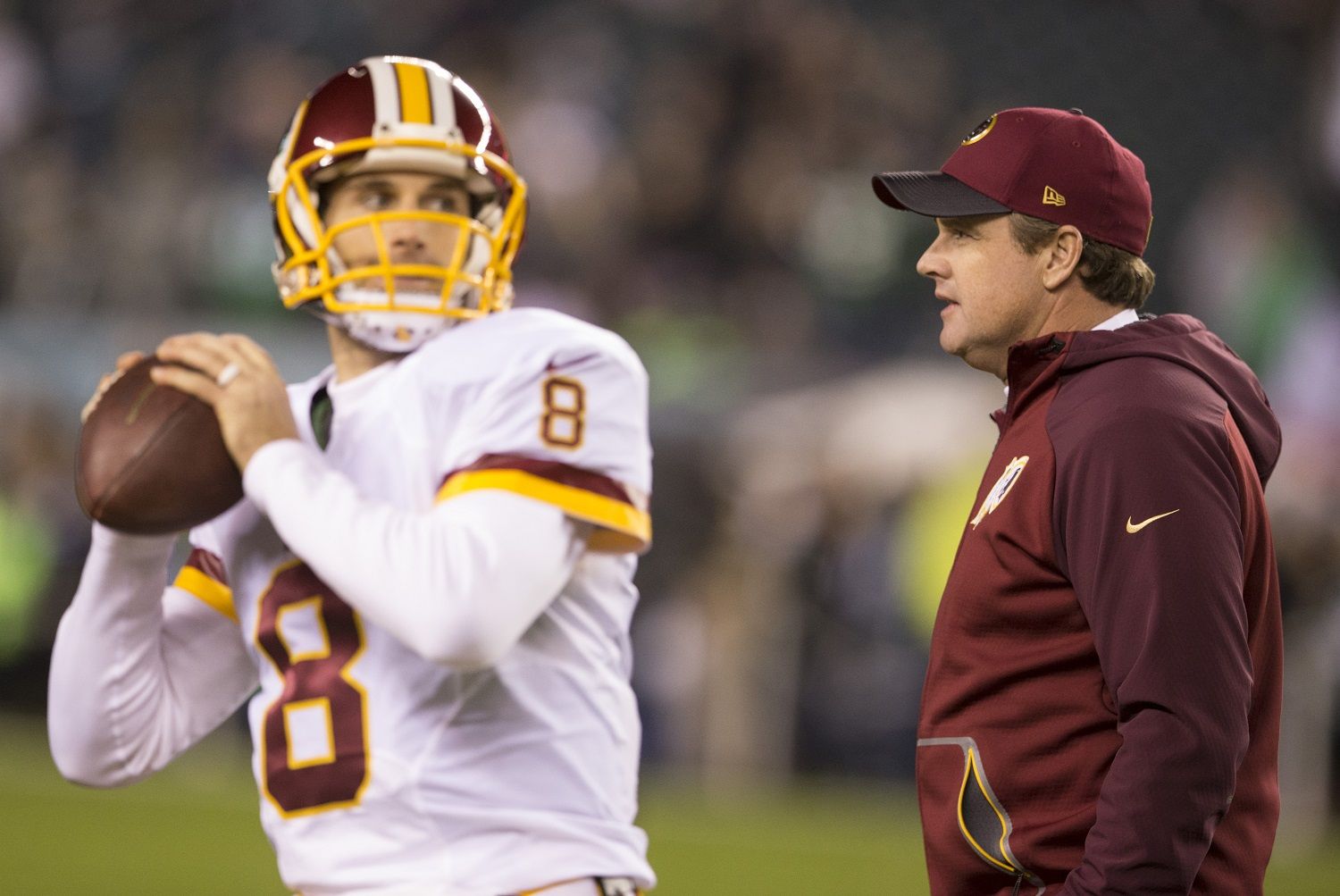 PHILADELPHIA, PA - DECEMBER 26: Kirk Cousins #8 of the Washington Redskins warms up as head coach Jay Gruden walks past him prior to the game against the Philadelphia Eagles on December 26, 2015 at Lincoln Financial Field in Philadelphia, Pennsylvania.  (Photo by Mitchell Leff/Getty Images)
