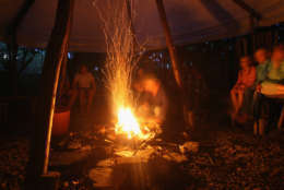 CARDIGAN, UNITED KINGDOM - AUGUST 15:  Campers gather around the camp fire at the Fforestcamp on August 15, 2008 near Cardigan in Pembrokeshire, Wales. Despite the dismal summer weather, camping is becoming an increasingly popular UK holiday option for a variety of reasons, including environmental concerns and the higher cost of living.  (Photo by Matt Cardy/Getty Images)