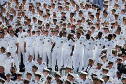 ANNAPOLIS, MD - SEPTEMBER 09: Navy Midshipmen stand arm and arm during a 9-11 tribute during the Navy and Tulane Green Wave game at Navy-Marine Corp Memorial Stadium on September 9, 2017 in Annapolis, Maryland.  (Photo by Rob Carr/Getty Images)