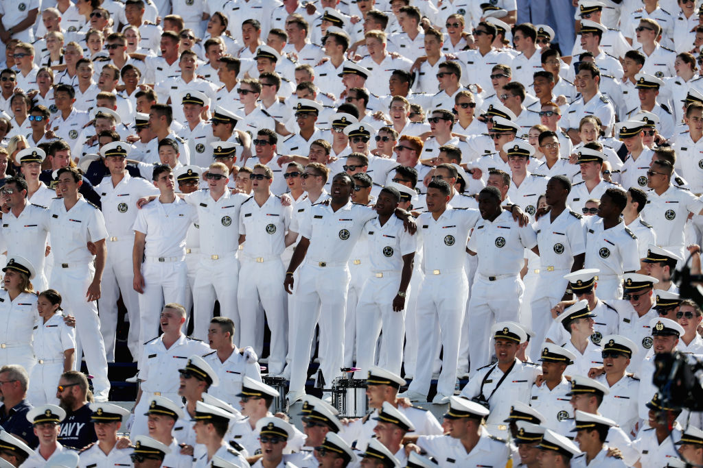 ANNAPOLIS, MD - SEPTEMBER 09: Navy Midshipmen stand arm and arm during a 9-11 tribute during the Navy and Tulane Green Wave game at Navy-Marine Corp Memorial Stadium on September 9, 2017 in Annapolis, Maryland.  (Photo by Rob Carr/Getty Images)