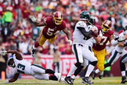 LANDOVER, MD - SEPTEMBER 10: Mason Foster #54 of the Washington Redskins flys in the air to tackle Quarterback Carson Wentz #11 of the Philadelphia Eagles in the fourth quarter at FedExField on September 10, 2017 in Landover, Maryland.  (Photo by Patrick McDermott/Getty Images)