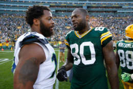 GREEN BAY, WI - SEPTEMBER 10:  Michael Bennett #72 of the Seattle Seahawks talks with brother Martellus Bennett #80 of the Green Bay Packers after the Packers defeated the Seahawks 17-9 at Lambeau Field on September 10, 2017 in Green Bay, Wisconsin.  (Photo by Joe Robbins/Getty Images)