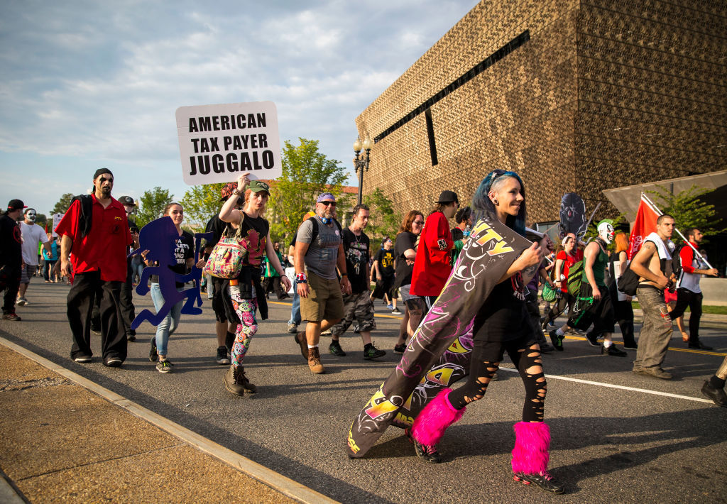 WASHINGTON, DC - SEPTEMBER 16:  Marchers walk past the National Museum of African American History and Culture, during the Juggalo March, on the National Mall, September 16, 2017 in Washington, DC. Fans of the band Insane Clown Posse, known as Juggalos, are protesting their identification as a gang by the FBI in a 2011 National Gang Threat Assessment. (Photo by Al Drago/Getty Images)