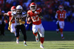CARSON, CA - SEPTEMBER 24:   Kareem Hunt #27 of the Kansas City Chiefs runs past  Tre Boston #33 of the Los Angeles Chargers for a touchdown during the second half of a game at StubHub Center on September 24, 2017 in Carson, California.  (Photo by Sean M. Haffey/Getty Images)