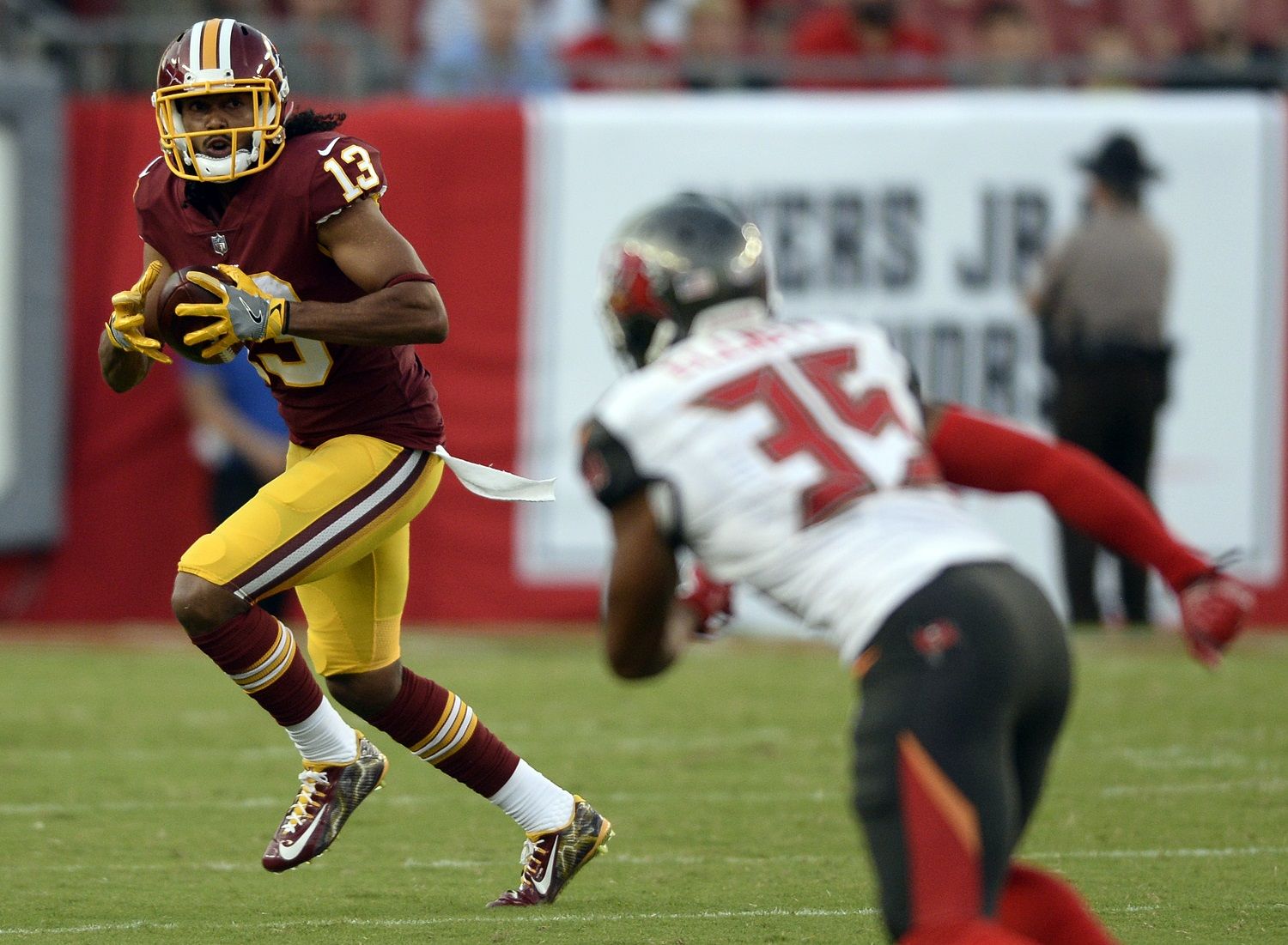 Washington Redskins wide receiver Maurice Harris (13) runs with the football after a reception against the Tampa Bay Buccaneers during the first quarter of an NFL preseason football game Thursday, Aug. 31, 2017, in Tampa, Fla. (AP Photo/Jason Behnken)