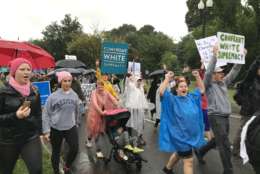 A 10-day protest march from Charlottesville to D.C. reached the finish line when soggy-wet demonstrators arrived, in a driving rain, at the Martin Luther King Jr Memorial. (WTOP/Dick Uliano)