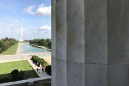 A view from the Lincoln Memorial toward the Washington Monument Tuesday. A man from the Kyrgyz Republic was arrested Monday on charges of defacing the Lincoln Memorial. National Park officials said the penny he used to etch letters into a stone pillar caused permanent damage. (WTOP/Megan Cloherty)