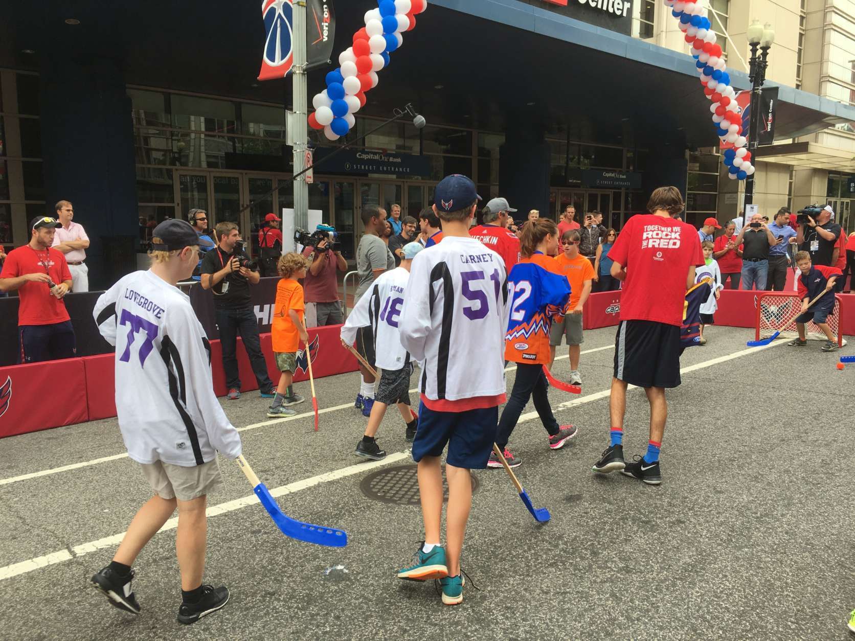Players from the American Special Hockey Association play street hockey in front of the Capital One Arena Friday before a visit from the Caps' Alex Ovechkin. (WTOP/Mike Murillo)