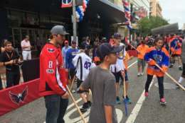 The Washington Capitals' Alex Ovechkin ducked out of practice early to join the players from the American Special Hockey Association in front of the Capital One Arena Friday. (WTOP/Mike Murillo)