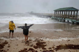 Mark Depenbrock (L) and his daughter Chloe Depenbrock brace against tropical storm strength winds on the beach near Anglins Fishing Pier as Hurricane Irma hits the southern part of the state Sept. 10, 2017 in Fort Lauderdale, Florida. The Category 4 hurricane made landfall in the United States in the Florida Keys at 9:10 a.m. after raking across the north coast of Cuba.  (Photo by Chip Somodevilla/Getty Images)
