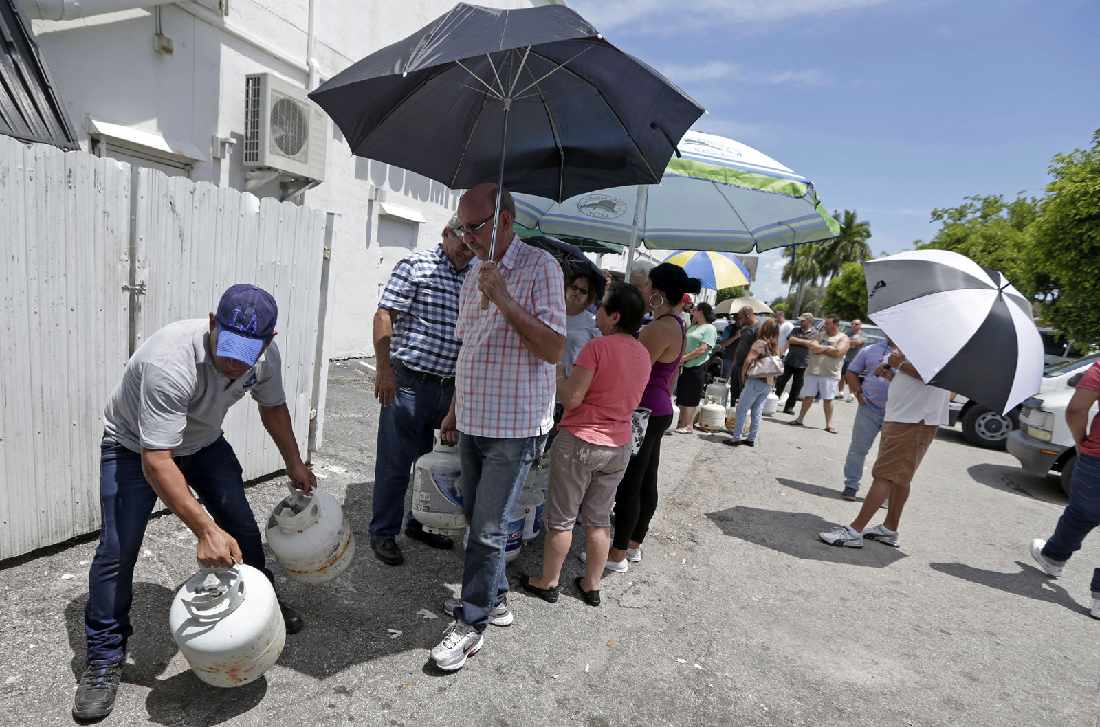 Residents stand in line to purchase propane gas as they prepare for Hurricane Irma, Tuesday, Sept. 5, 2017, in Hialeah, Fla. Hurricane Irma grew into a dangerous Category 5 storm, the most powerful seen in the Atlantic in over a decade, and roared toward islands in the northeast Caribbean Tuesday on a path that could eventually take it to the United States. (AP Photo/Alan Diaz)