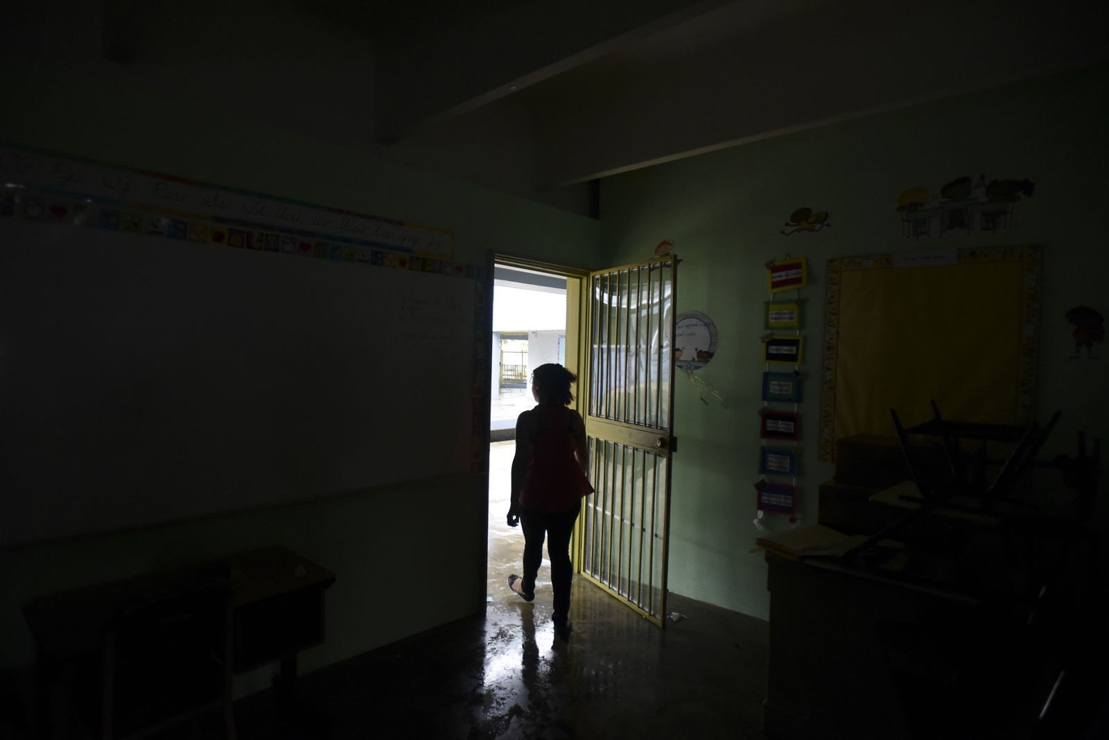 A woman looks outside from a shelter set up at the Berta Zalduondo elementary school during the passage of Hurricane Irma in Fajardo, northeastern Puerto Rico, Wednesday, Sept. 6, 2017. Heavy rain and high winds lashed Puerto Ricoâ€™s northeast coast Wednesday as Hurricane Irma roared through Caribbean islands. (AP Photo/Carlos Giusti) NO PUBLICAR EN PUERTO RICO