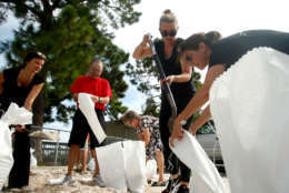 Residents work together to fill sandbags for each other at Bobby Hicks Park as residents prepare ahead of Hurricane Irma on Sept. 5, 2017 in Tampa, Florida.  The National Hurricane Center (NHC) has reported that  Hurricane Irma has strengthened to a Category 5 storm as it crosses into the Caribbean and is expected to move on towards Florida.  (Photo by Brian Blanco/Getty Images)
